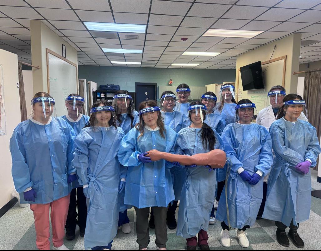 Northern's inaugural phlebotomy class poses in their phlebotomy gear.