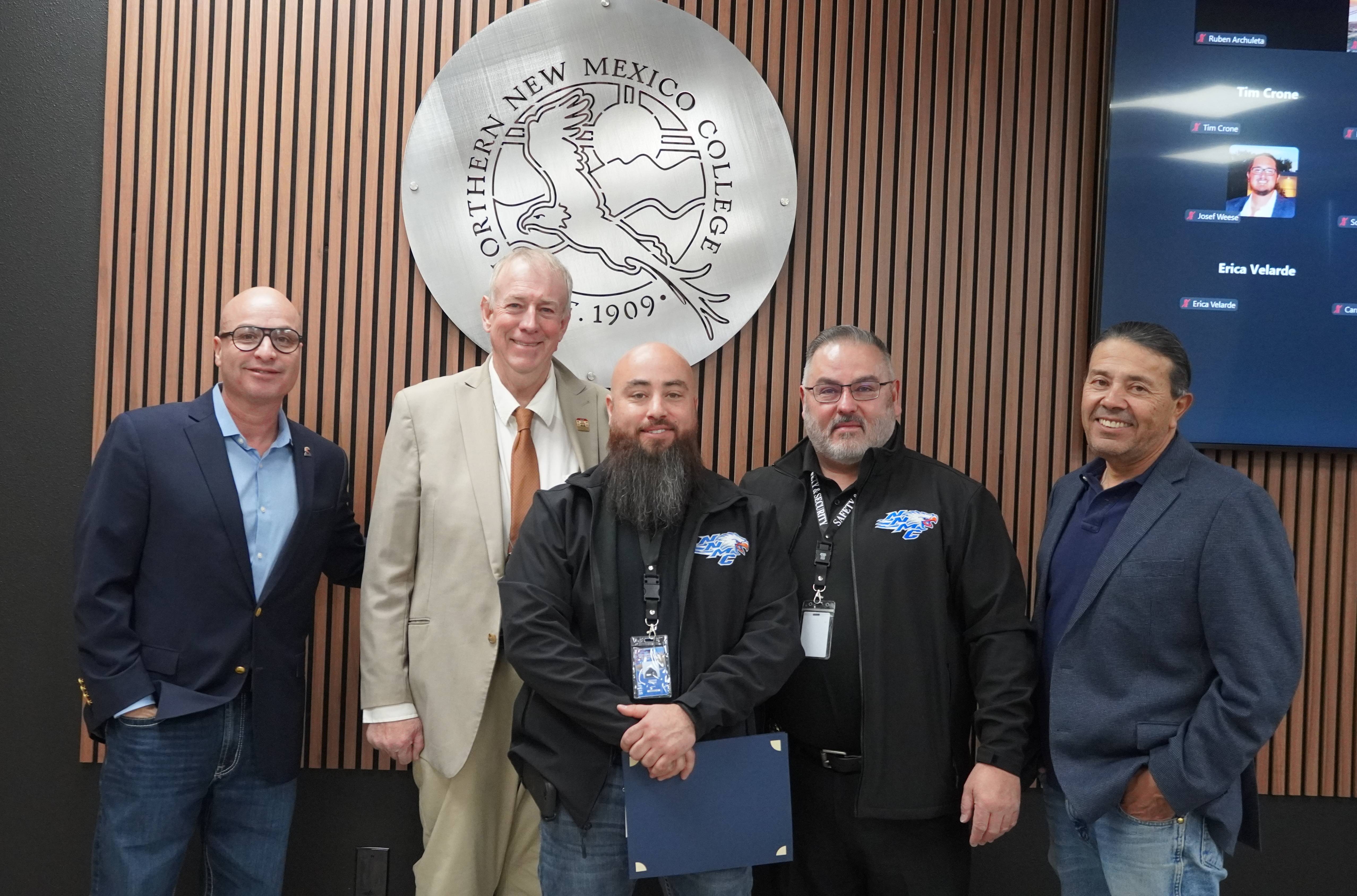 Officer Trinidad “Trinny” Lucero with President Balderas, NNMC Board President Michael Martin, board member Ron Lovato, and Henry “Geno” Trujillo Director, Safety & Security 